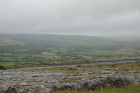 Karst pavements and topography of the Burren approx 5km south of Ballyvaughan Co Clare Ireland. Exposures of the Dinantian Burren Limestone Formation are composed of shallow water carbonates. Note the clints (limestone blocks) and grikes (joints formed by Variscan folding (Coller, 1984) and fracturing) enlarged by Pleistocene disolution (Williams, 1966).